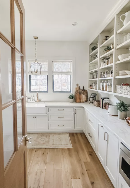 The prep kitchen is where all of the work takes place; it includes small appliances, a deep farmers sink and ample shelving for pantry staples