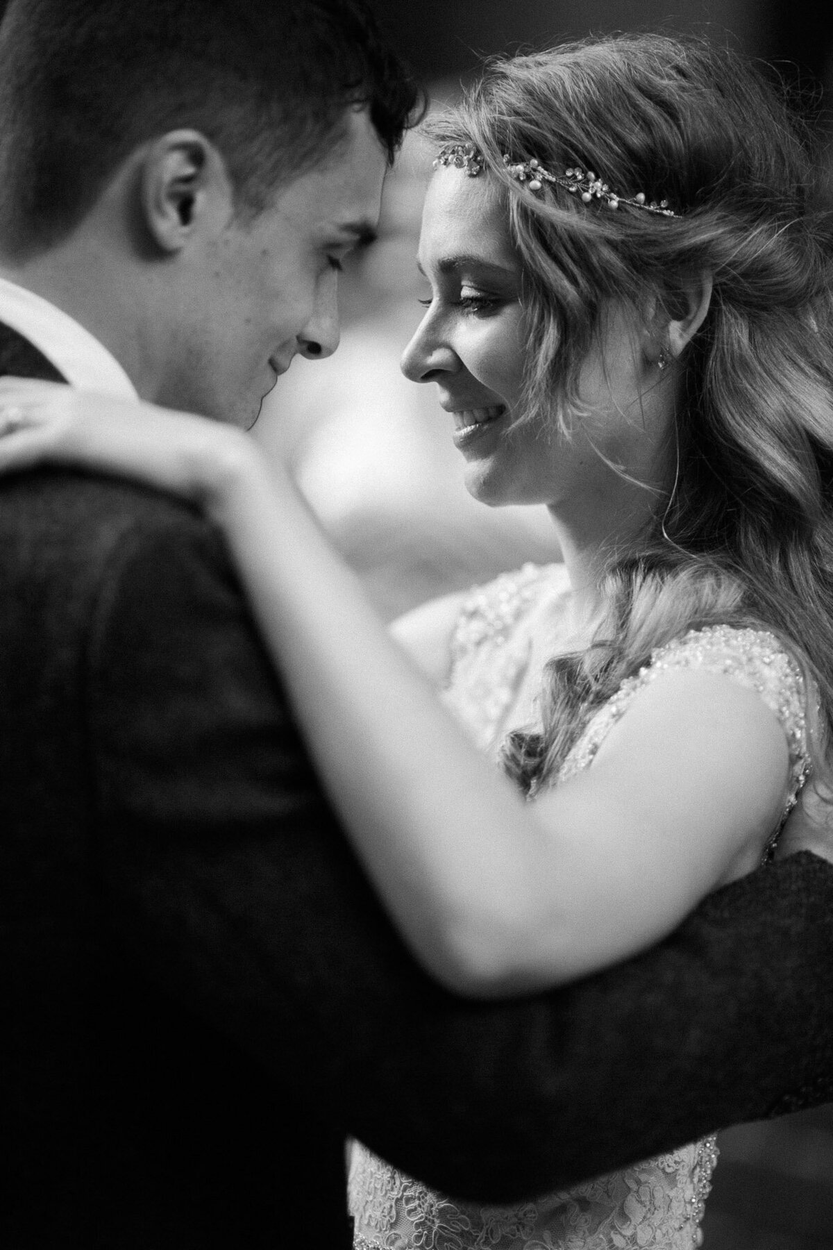 Emotional-black-and-white-photo-of-bride-and-groom-during-their-first-dance-at-Seattle-wedding-venue-Court-in-the-Square-by-Joanna-Monger-Photography
