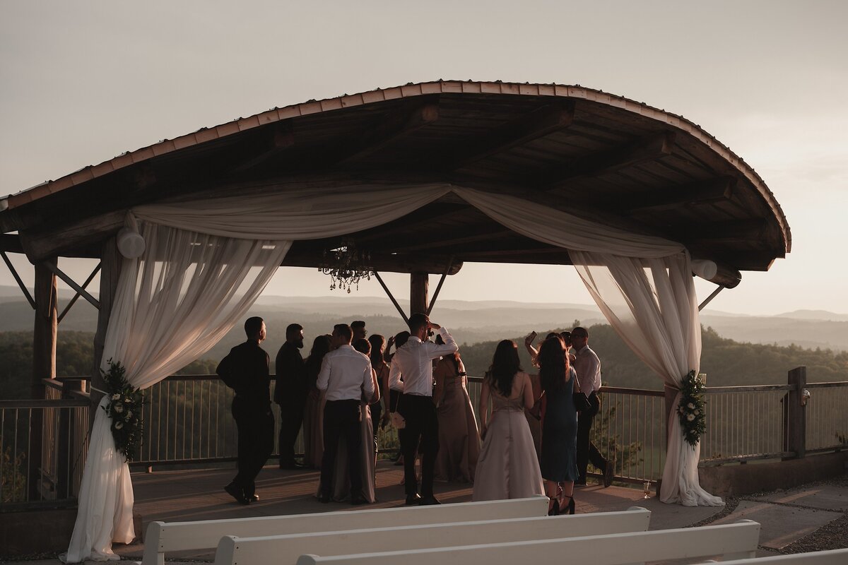 guests enjoy sunset over quebec hills at le belvedere