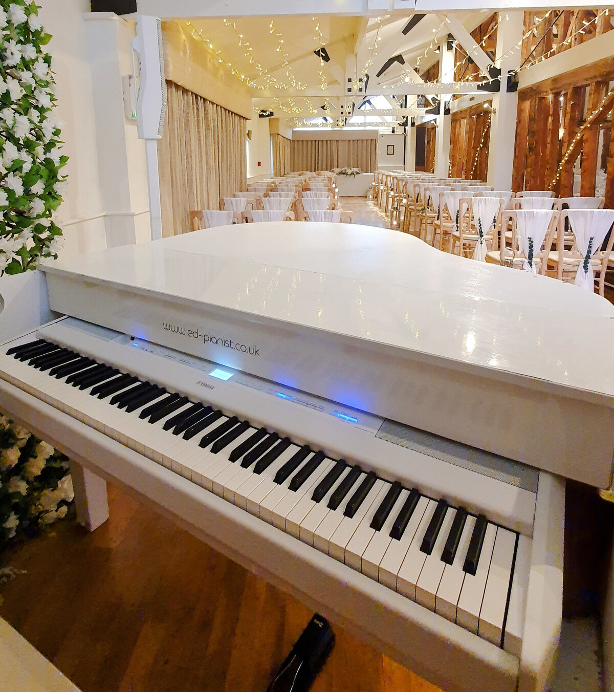 white baby grand piano hire for wedding ceremony