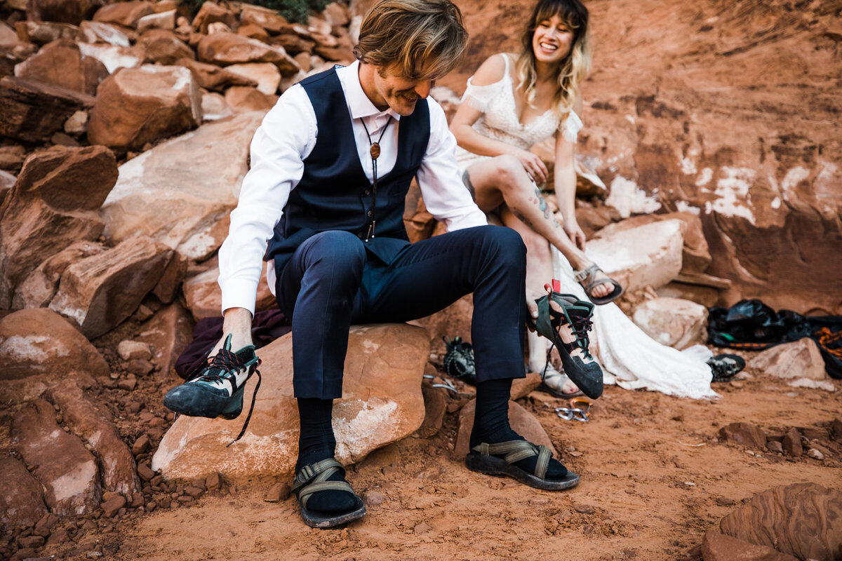 the couple, having just eloped, smiles in the desert.