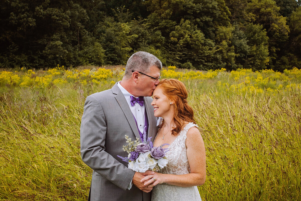 bride and dad pose