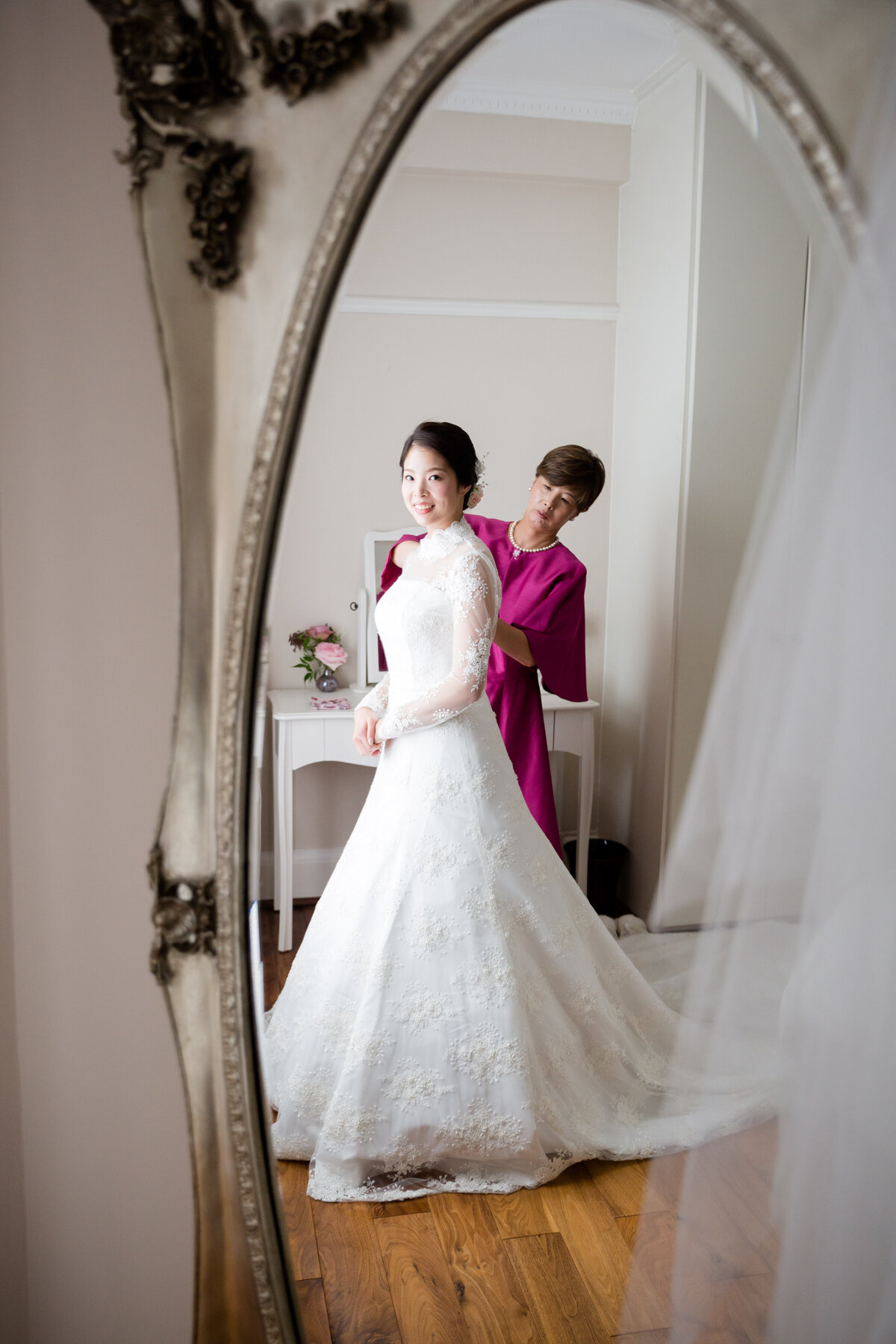 Mother of the Bride and the Bride reflected in a mirror