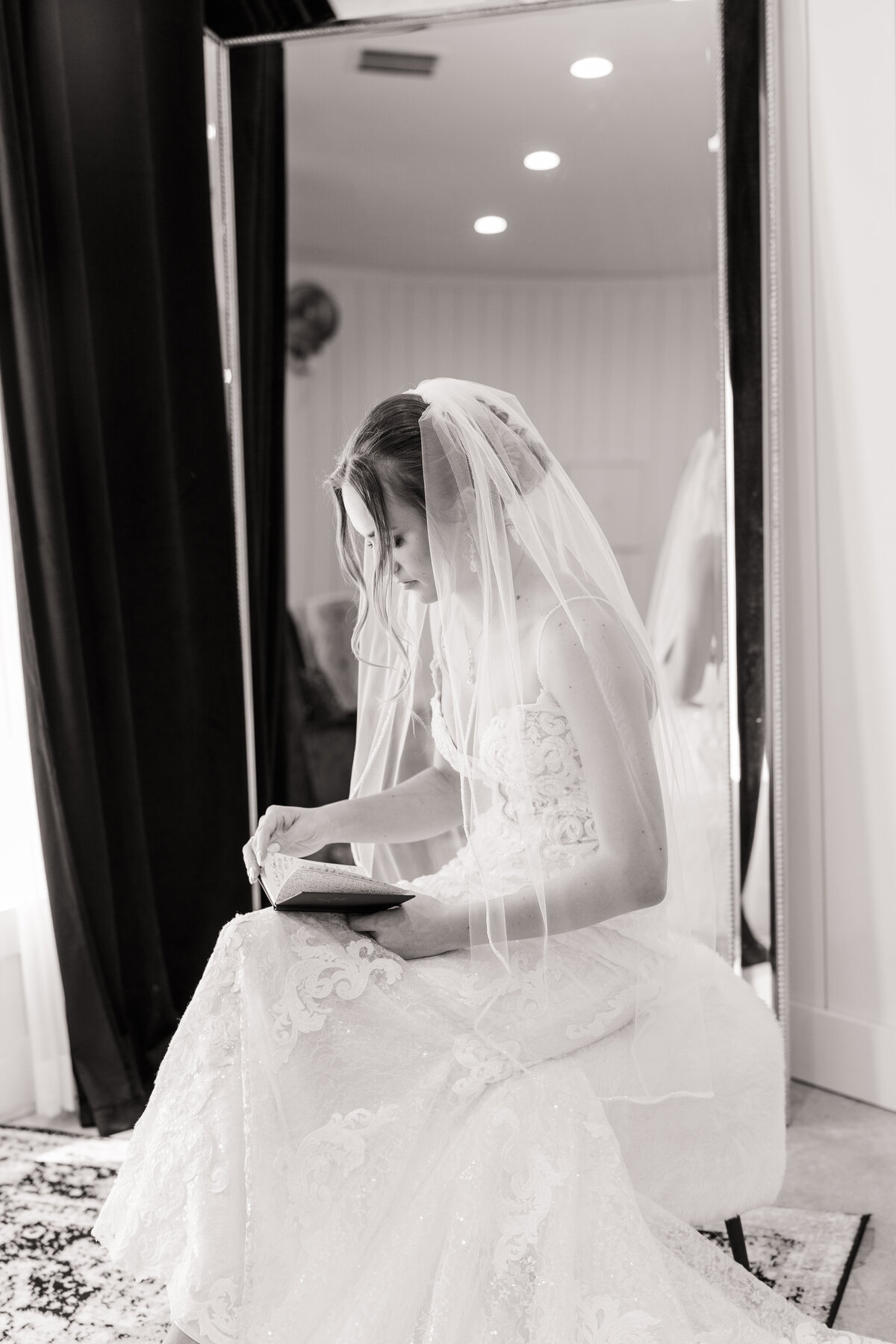 Bride reading letter from Groom while getting ready before wedding ceremony at The Ranch House