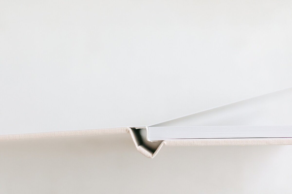 A close up showing the page thickness and binding of heirloom albums available to display your Indianapolis boudoir photos.