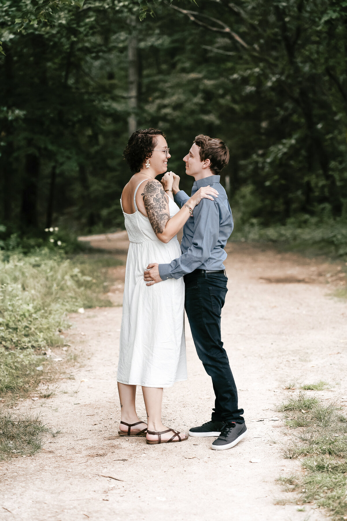 Timeless Love: A beautiful moment captured in engagement photos by Danielle Littles Photography, showcasing the genuine connection and joy between the enchanting couple.