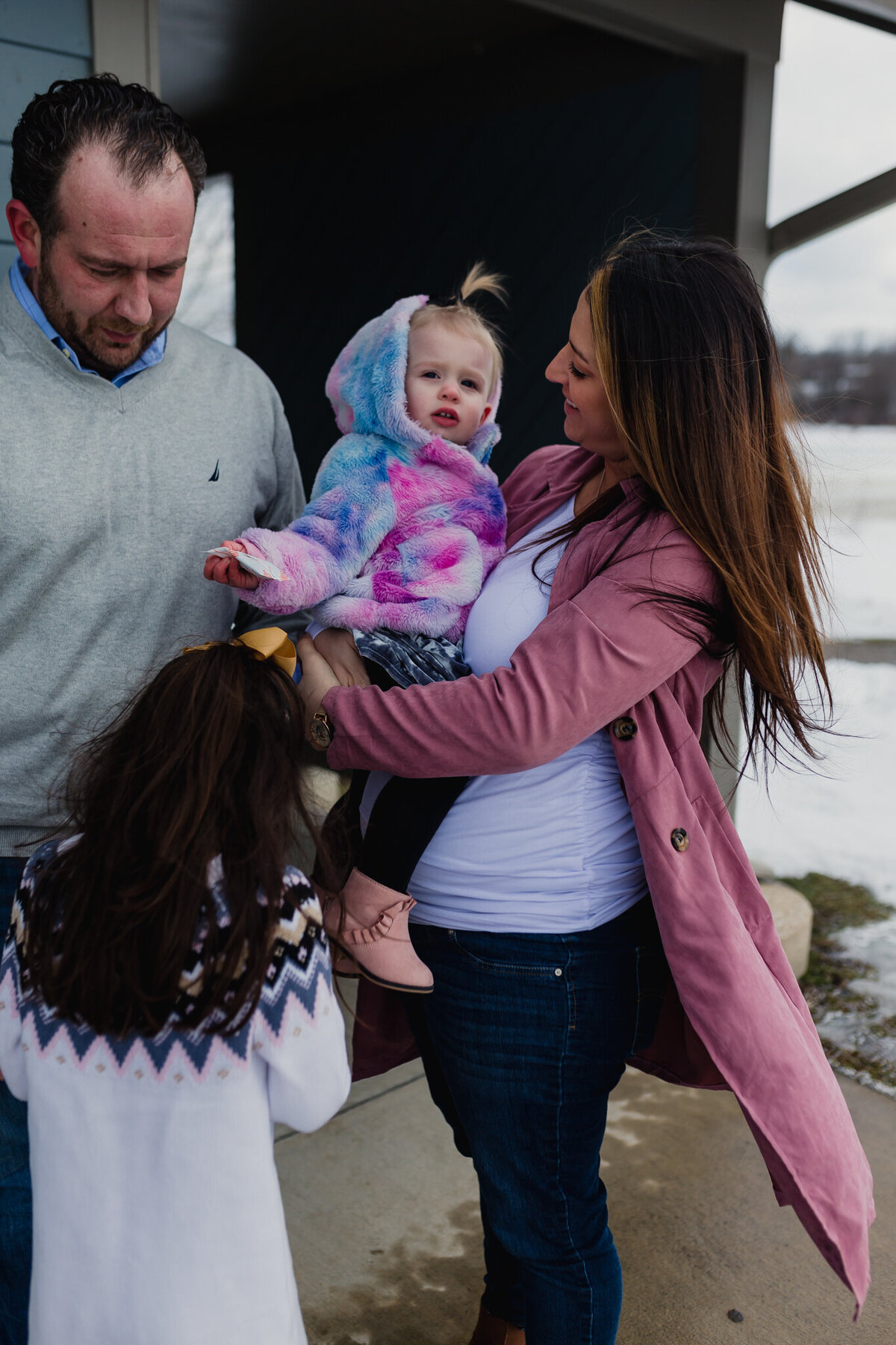 Family photography session with mom, dad, and two young children.
