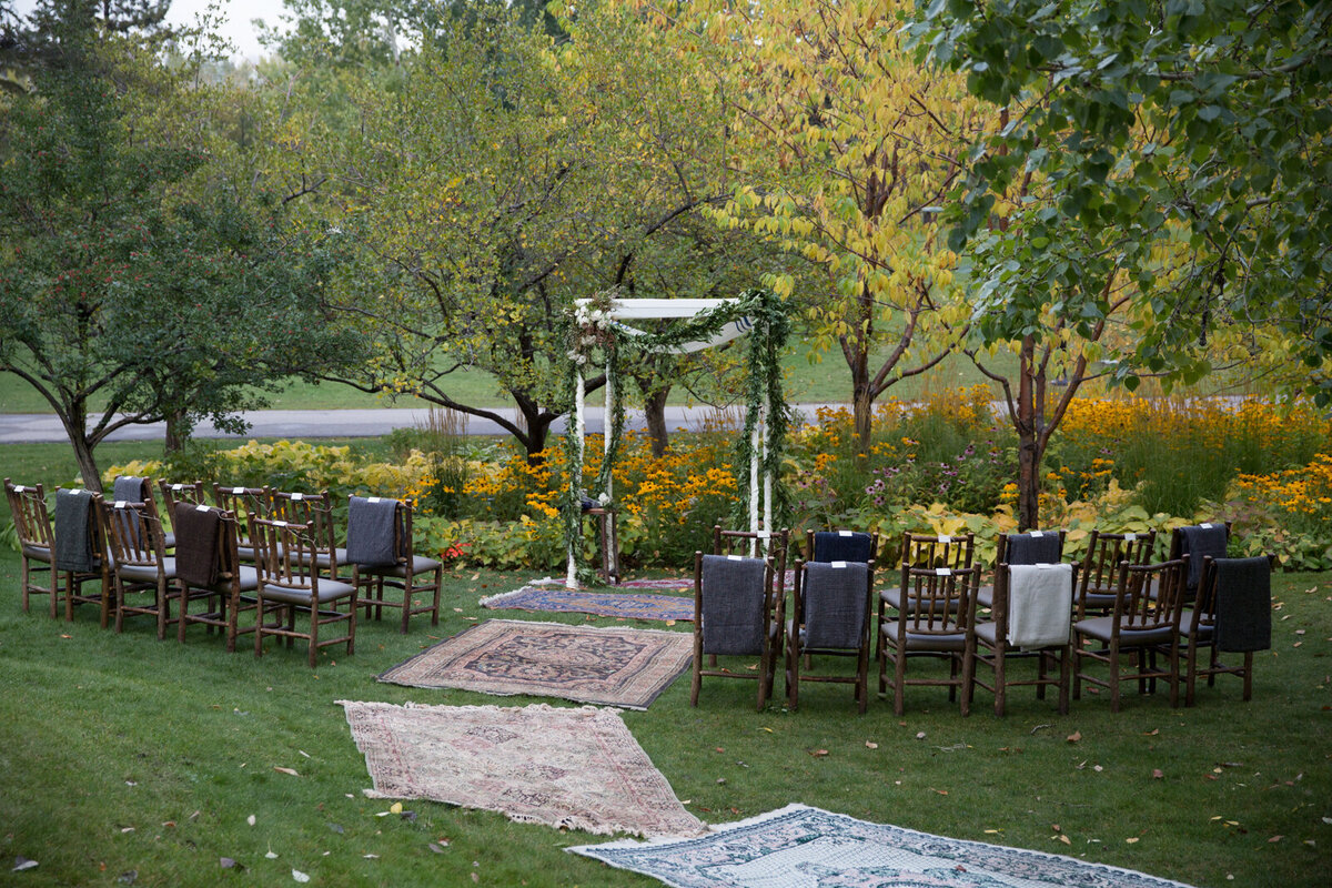 Classic outdoor ceremony at River Cafe, a riverside wedding venue in downtown Calgary, featured on the Brontë Bride Vendor Guide.