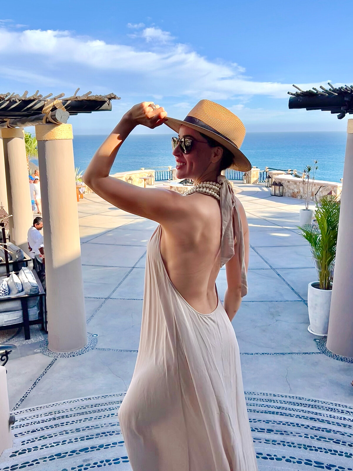 Woman posing on the entrance of  the Hotel Esperanza in Los Cabos