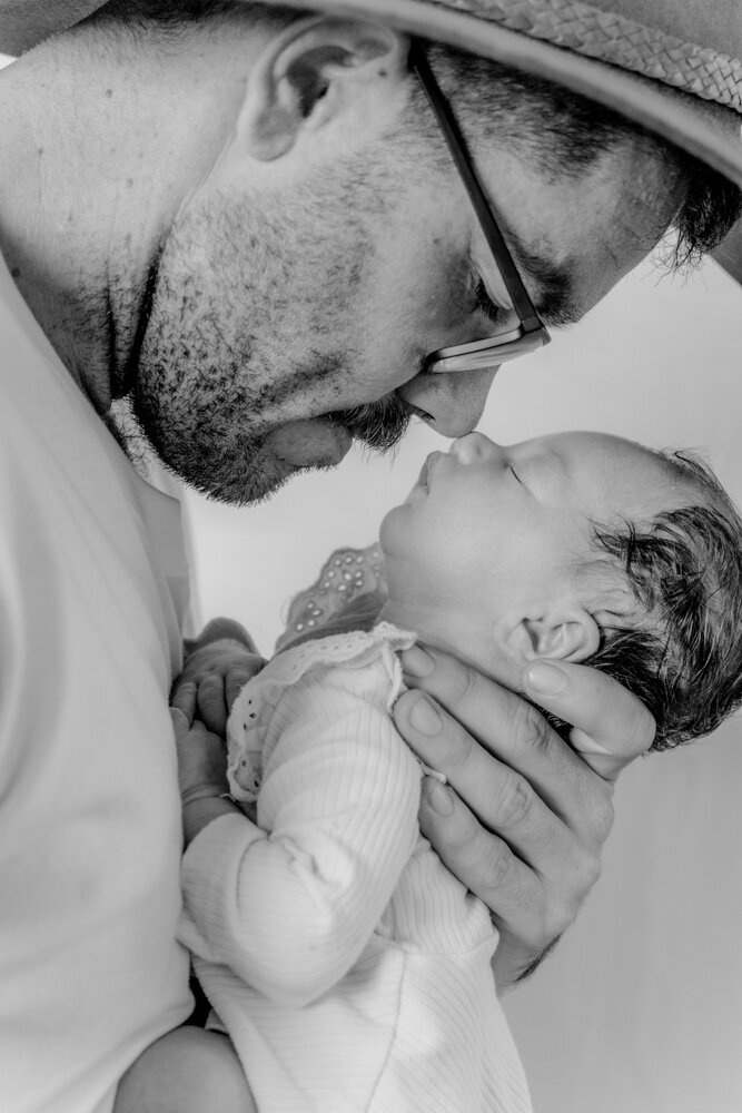 new dad touching noses with newborn baby boy - Townsville Newborn Photography by Jamie Simmons