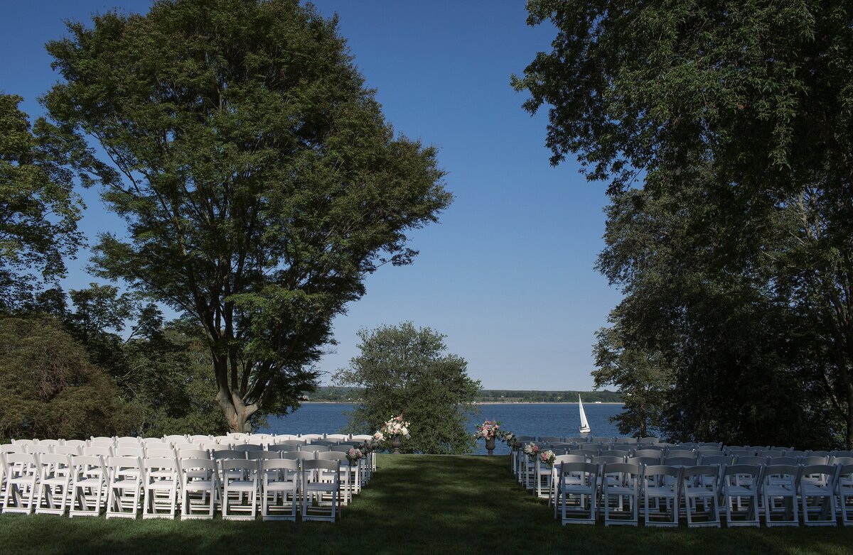Wedding ceremony decor and chairs with view of water at Glen Manor House.