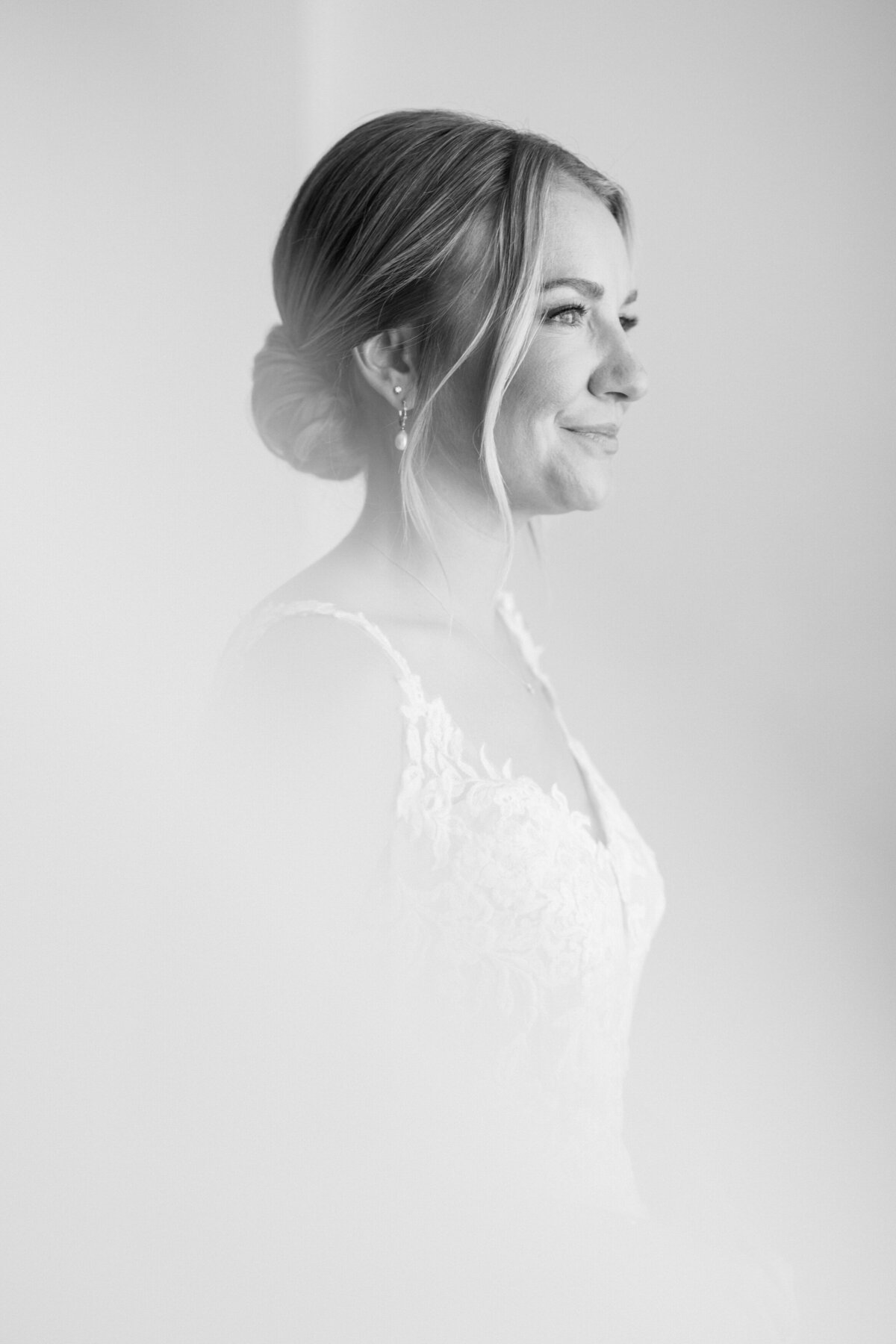 Black and white portrait of bride with soft light and elegant updo at her Cancun destination wedding.