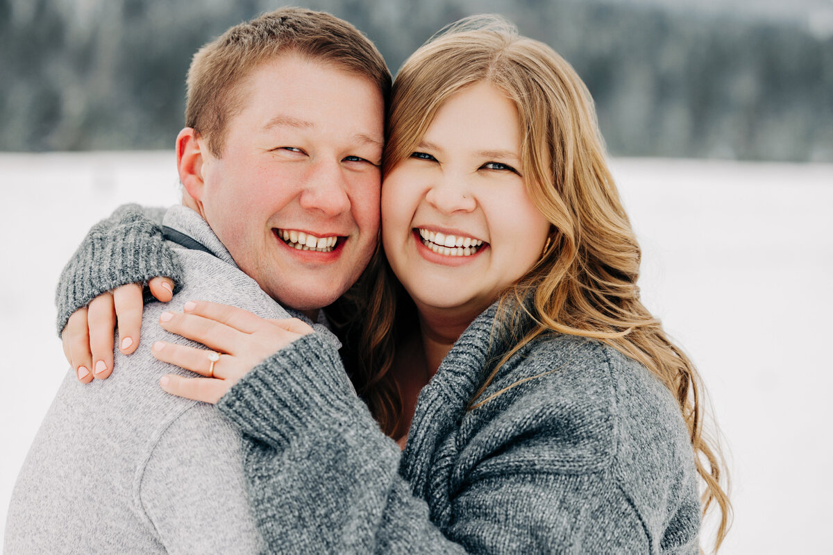 Winter engagement photo of Missoula couple at Blue Mountain Trailhead