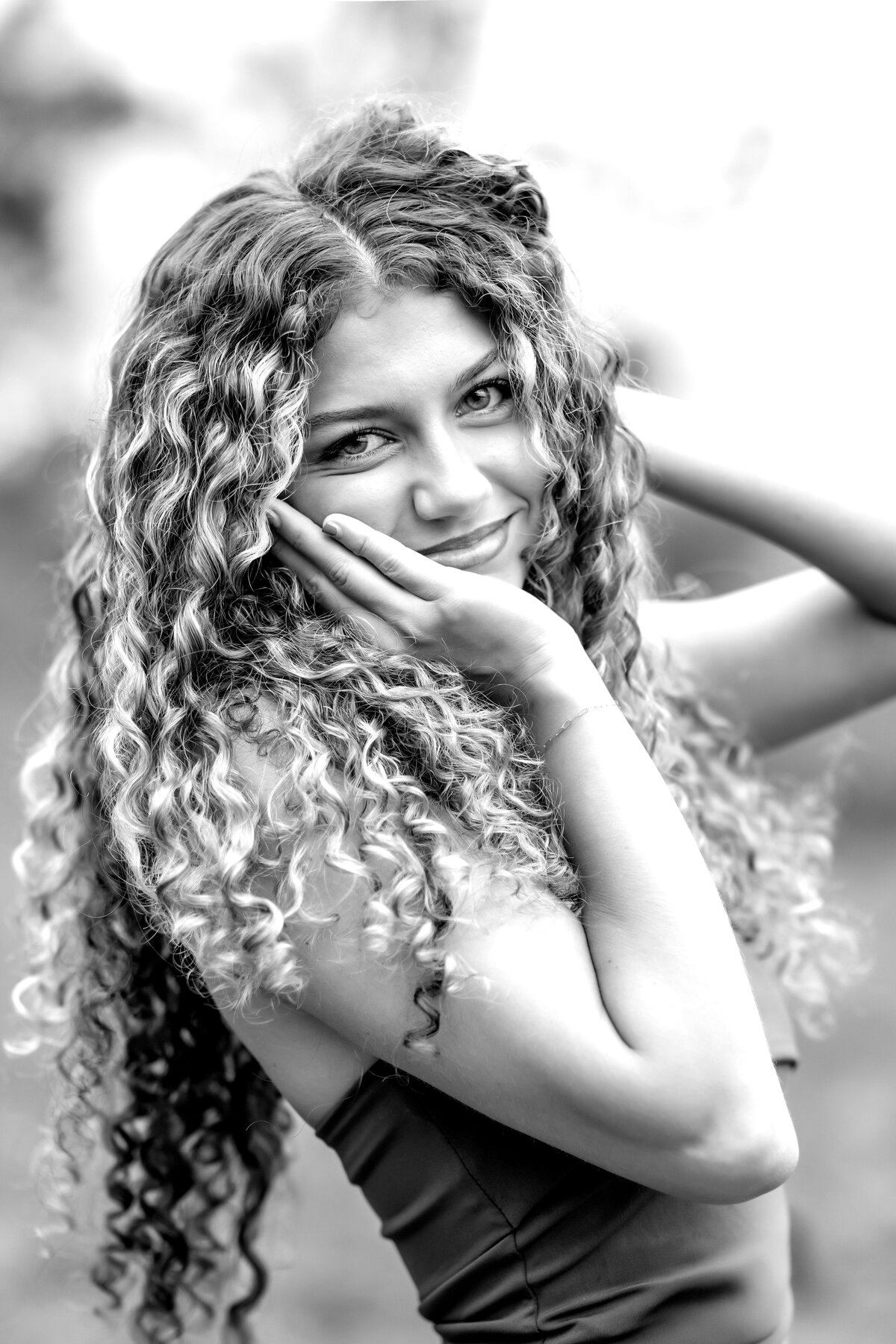 Black-and-white close-up senior portrait of a teen girl during her Orlando senior photoshoot.