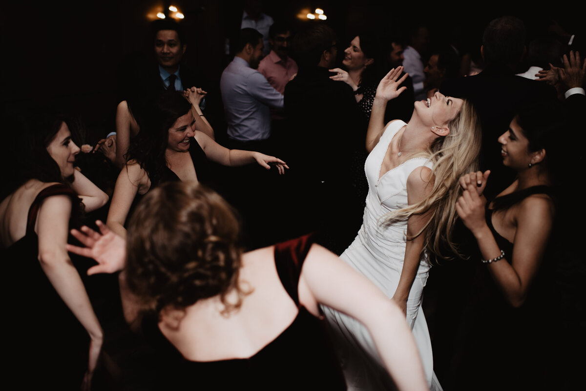 Photographers Jackson Hole capture bride dancing with guests