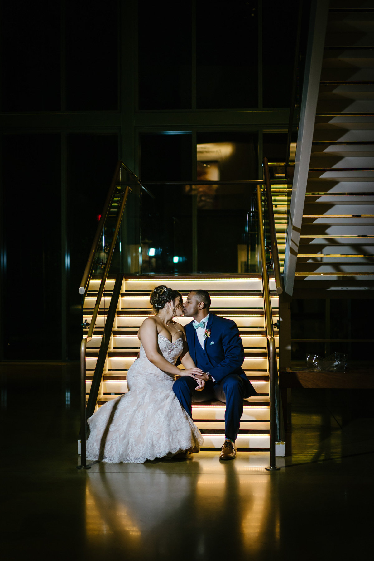 bride and groom kissing in the Witte Museum in San Antonio posing for a picture by Expose The Heart Wedding Photography