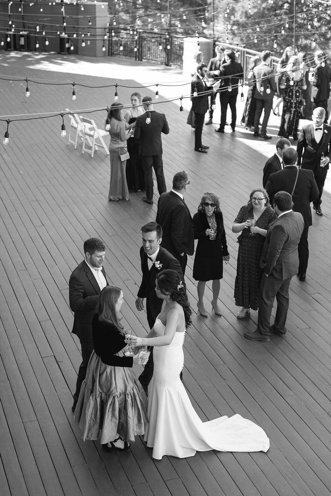 Wedding guests erupting in laughter during the reception, photographed in a natural, storytelling style.