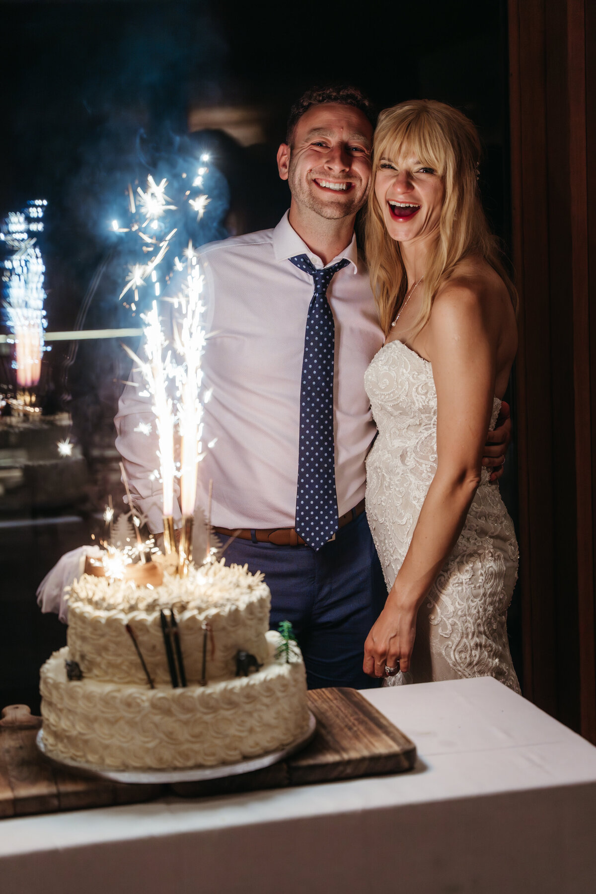 Wedding cake with sparklers at alpine lodge celebration