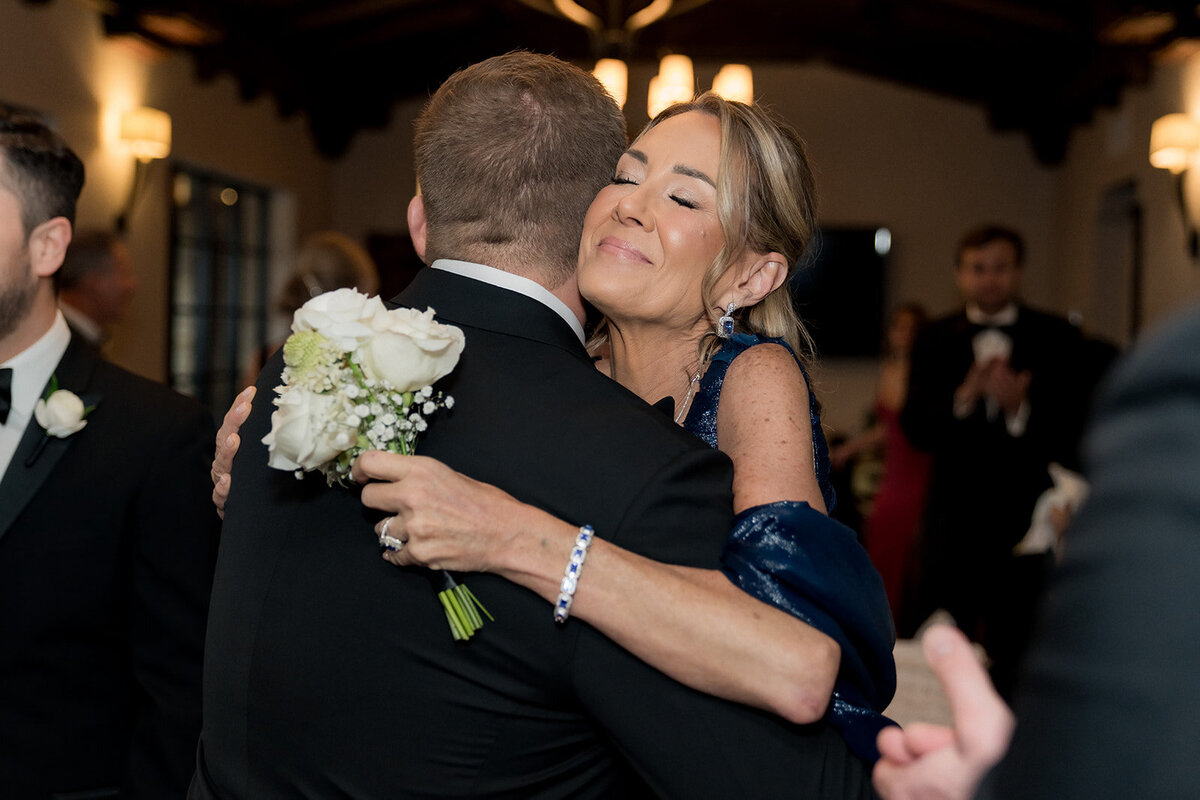 mom-hugging-son-in-law-revel-motor-row-HBICWeddings