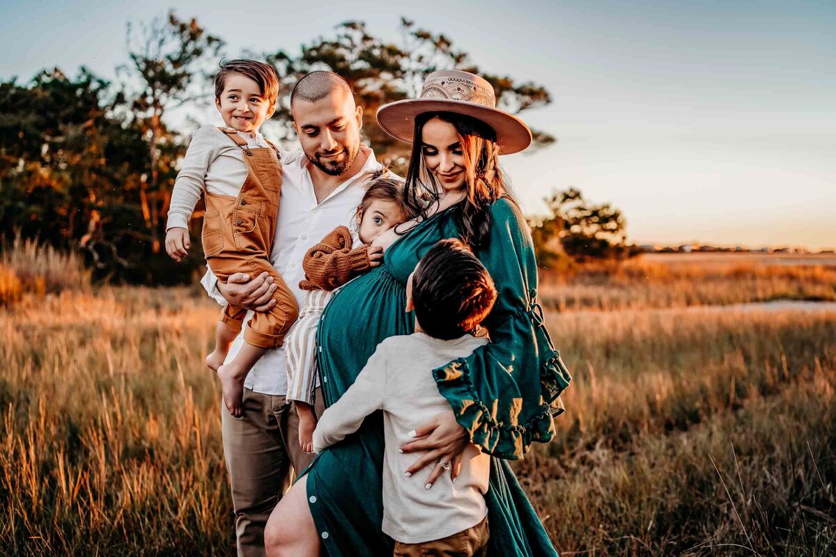 Golden hour family session in Charleston marshland with parents and kids