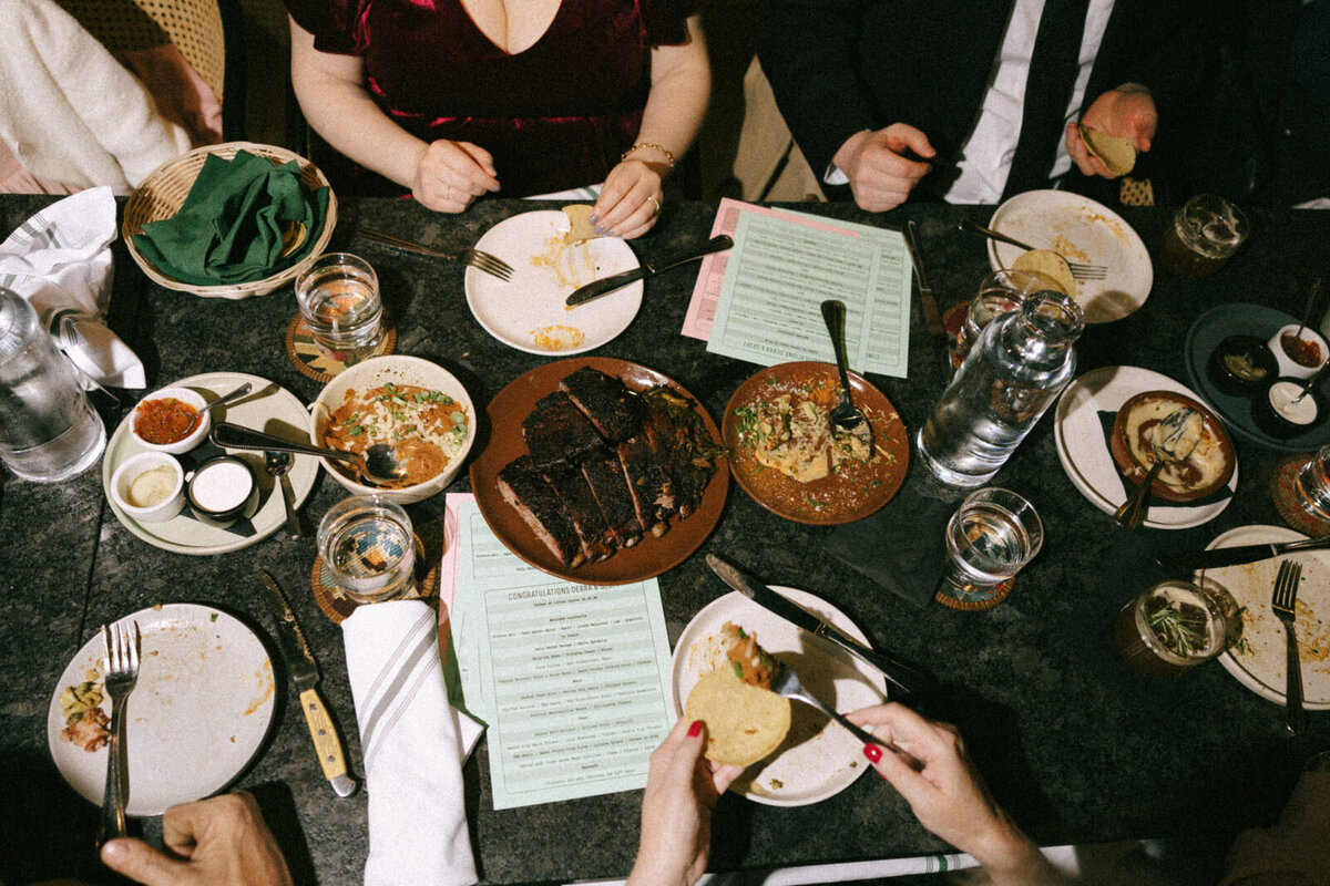 Guests enjoying a wedding reception at a local restaurant, by Andrea-Marie Photography