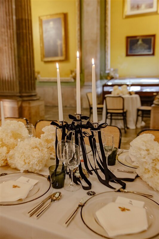 Welcome dinner at General Prim in Mexico City, with black bows and candlelight
