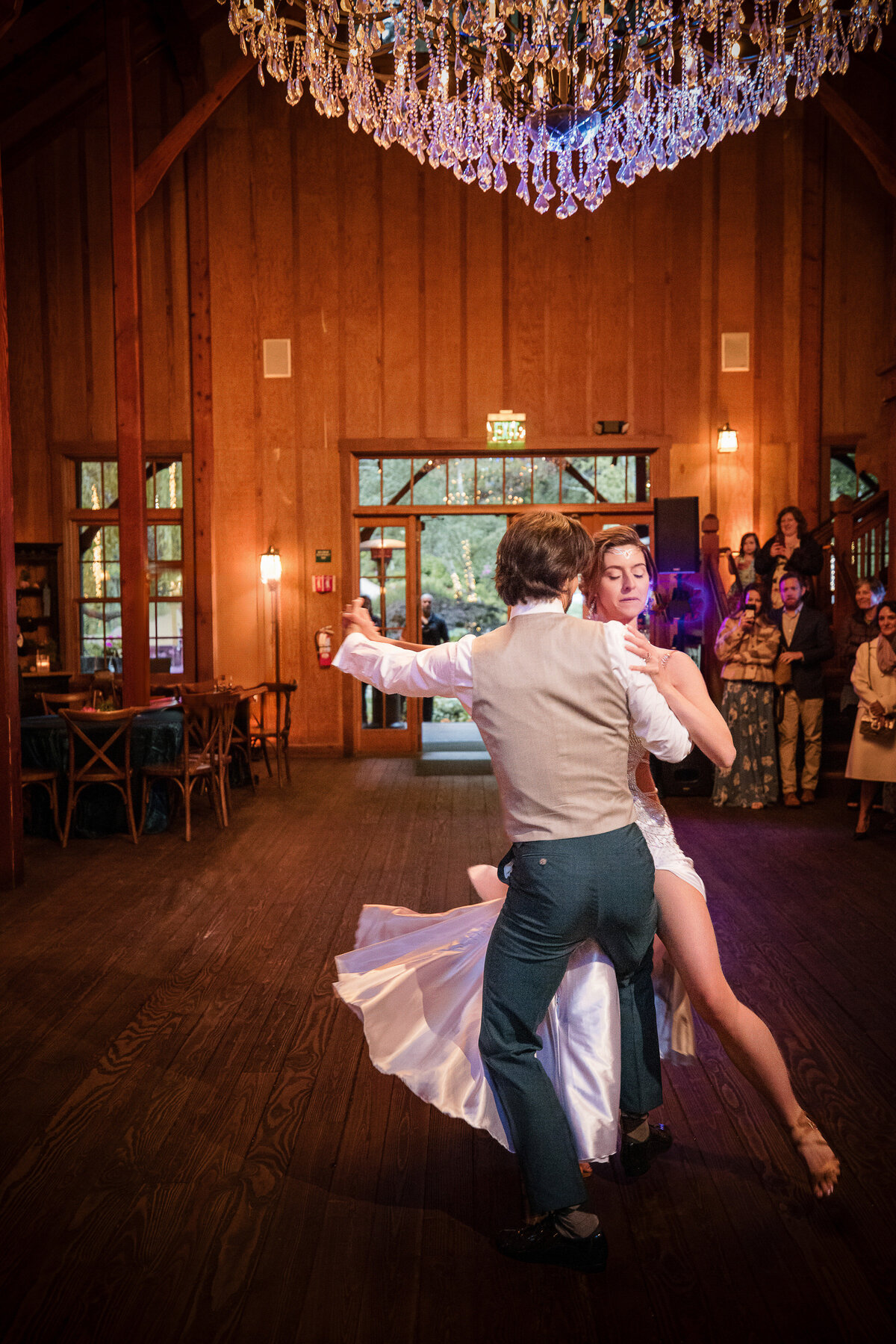 A bride and groom share a first dance  at a destination wedding at Nestldown in Los Gatos, California