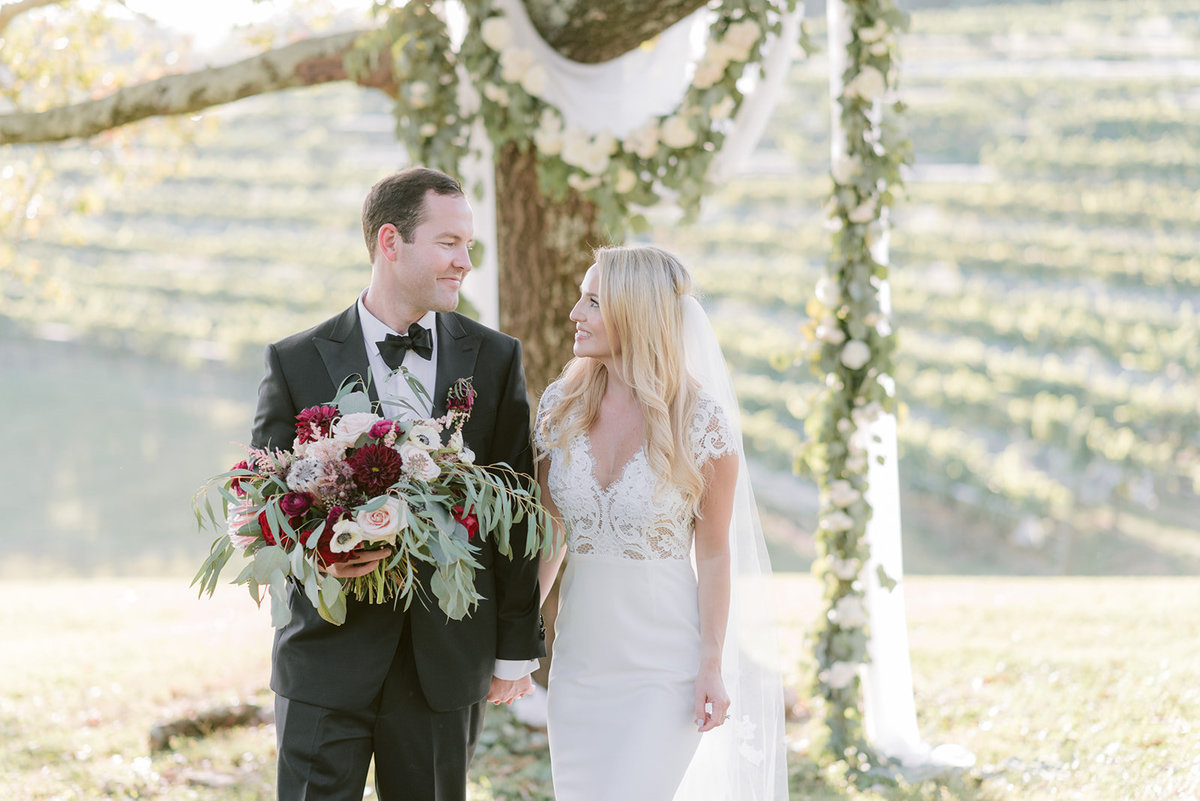Montaluce winery and restaurant with white flowers and garland and burgundy bouquet