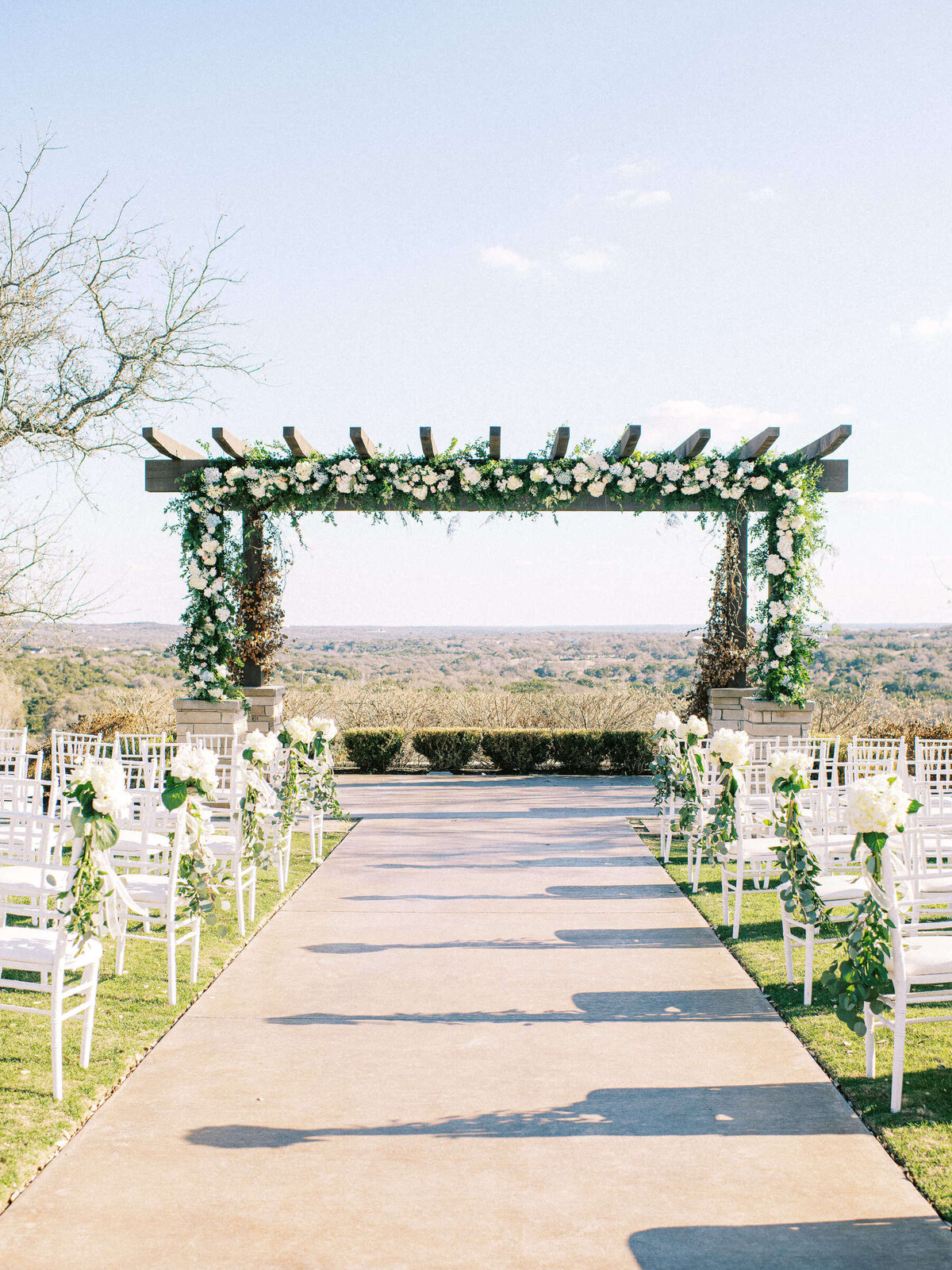 Outdoor wedding ceremony setting for Canyonwood Ridge wedding in Dripping Springs, Texas