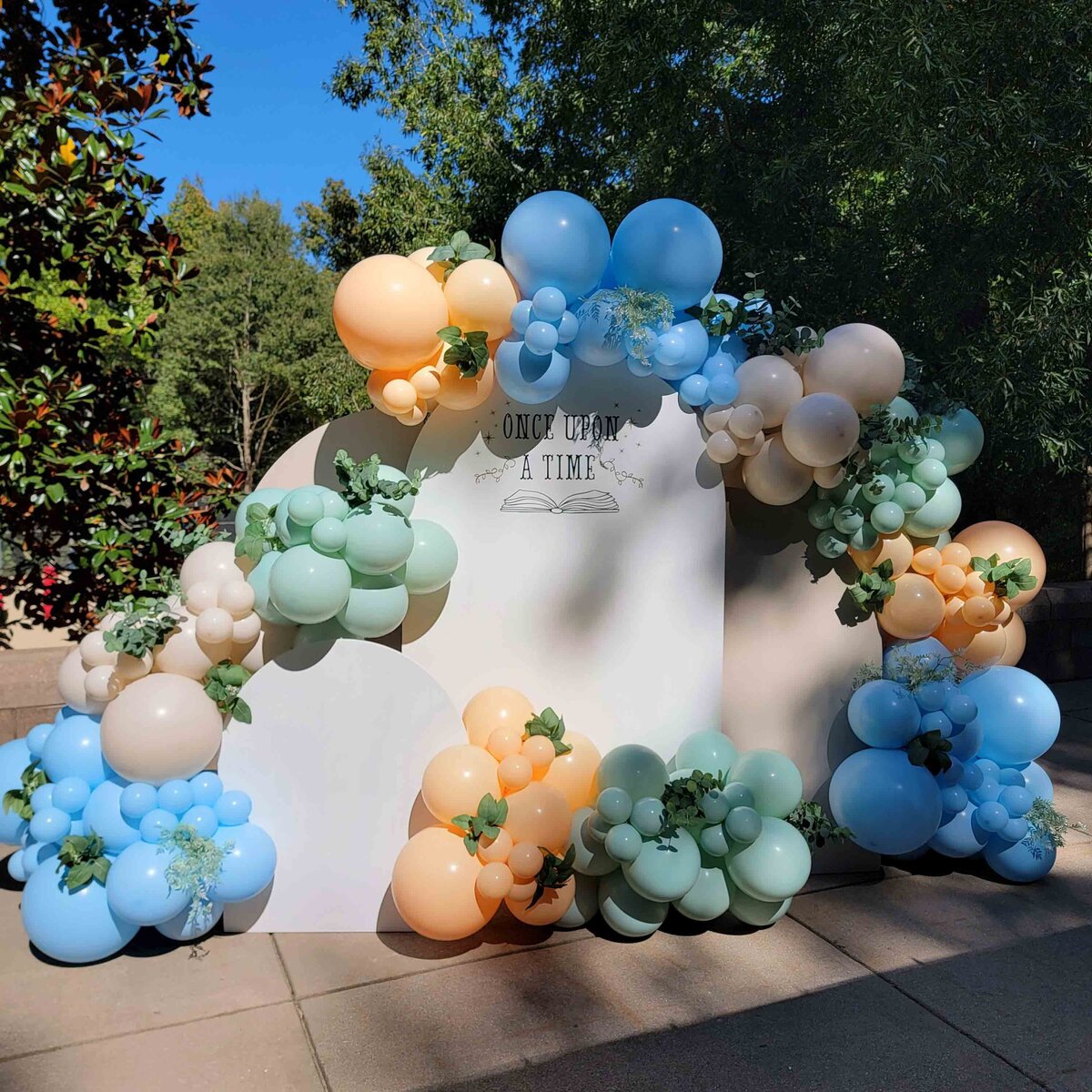 A fairytale with Air with Flair decor Custom Balloon Installation, featuring Blue and Green Once Upon a Time magic. The whimsical and enchanting ambiance of our expertly crafted balloon artistry