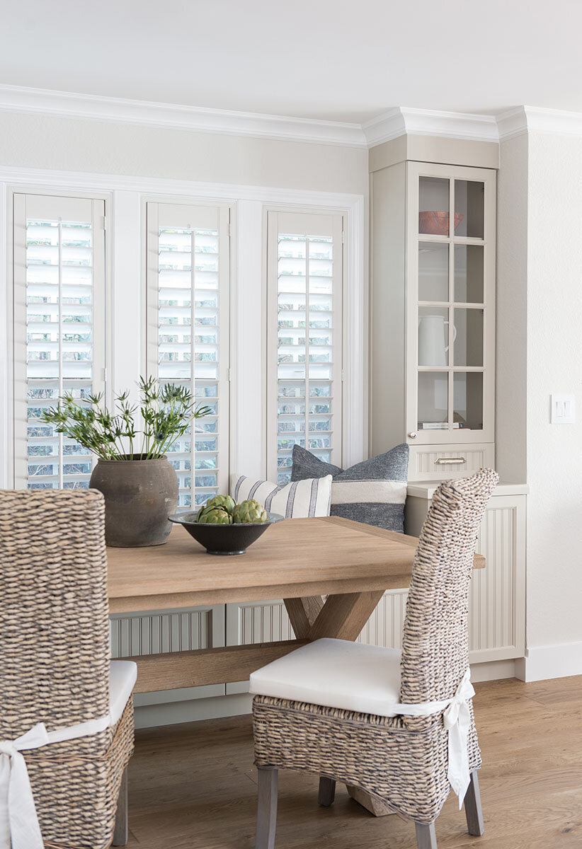 wood table with rattan chairs