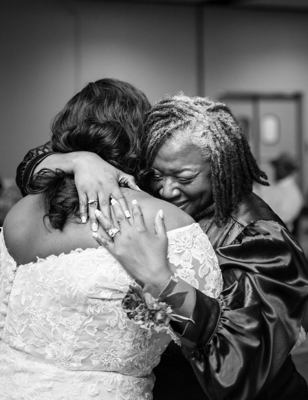 Mother cries as she squeezes her daughter during their first dance at her wedding at the Wigwam Event Center in Pickerington, Ohio.