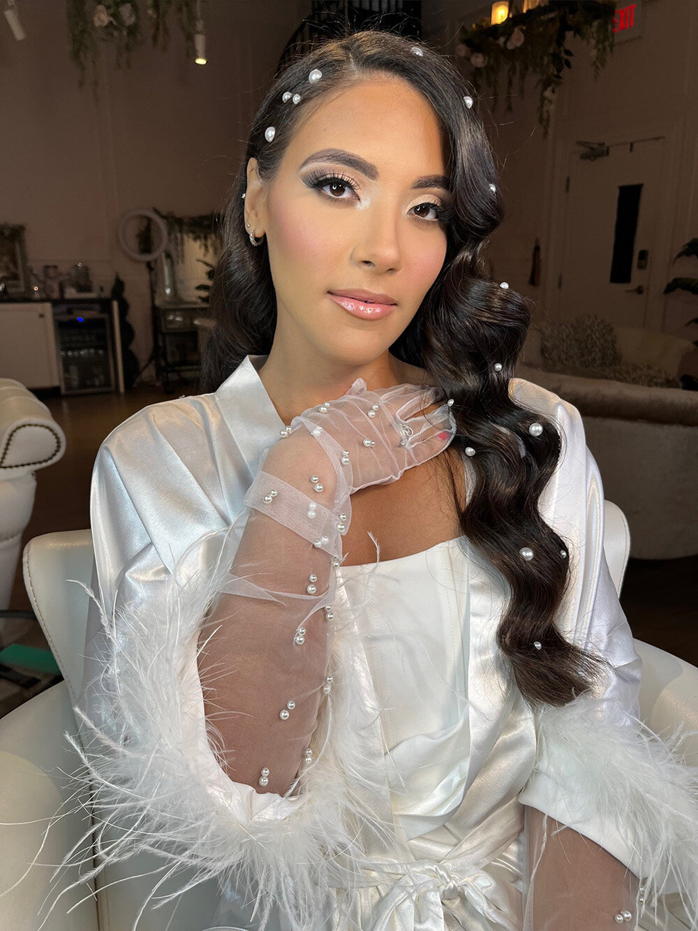 Bride in a white wedding dress and elegant gloves showcasing glowing skin and wedding makeup by Skinlux Beauty Bar.