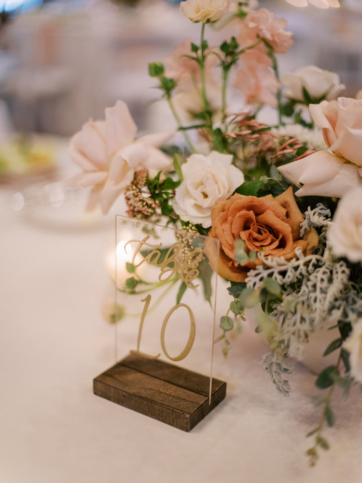 whimsical wedding centerpieces with acrylic table numbers