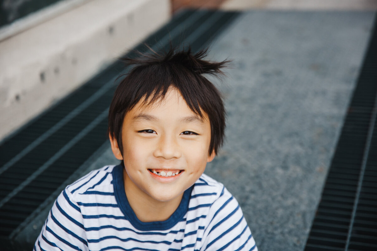 Close up of 9 year old boy in Liberty Village during Family portraits