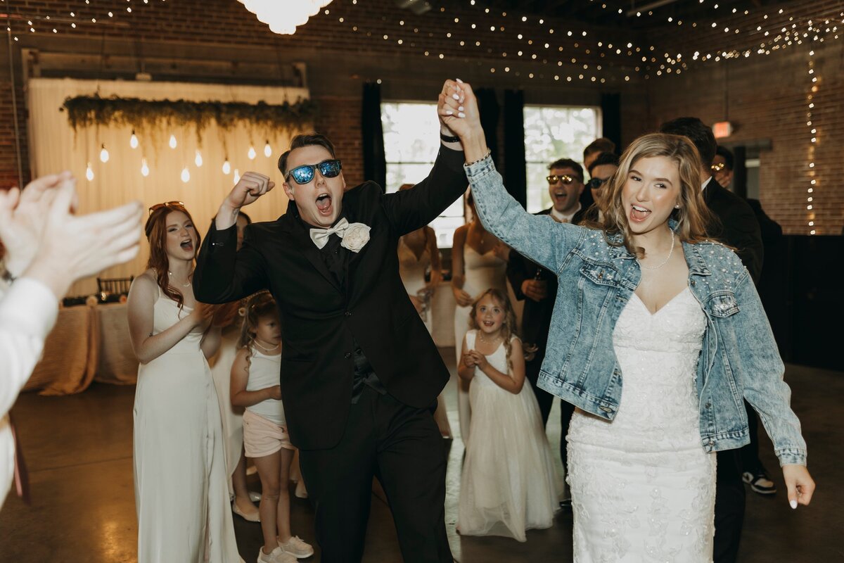 bride and groom celebrating at reception