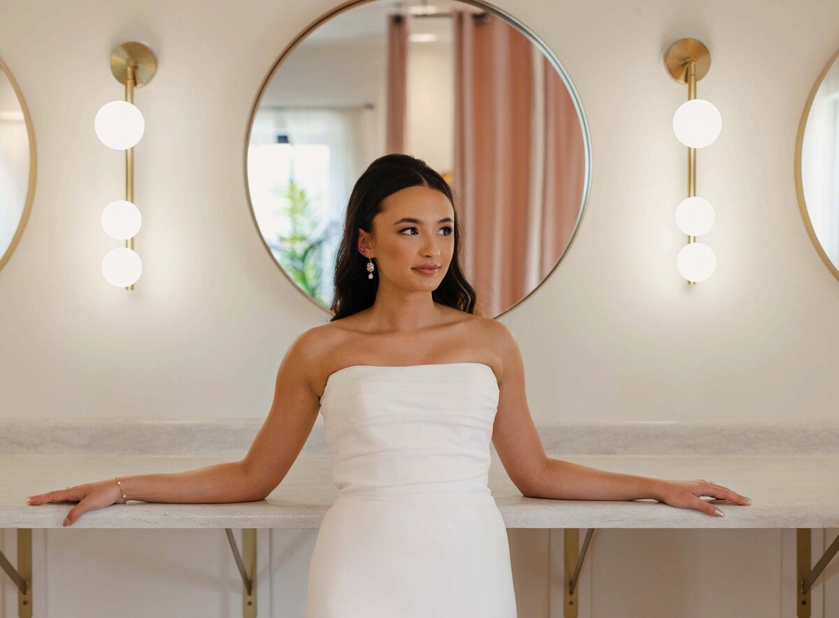 Bride with modern sleek updo and soft glam makeup in Chicago, IL. Wedding beauty services.
