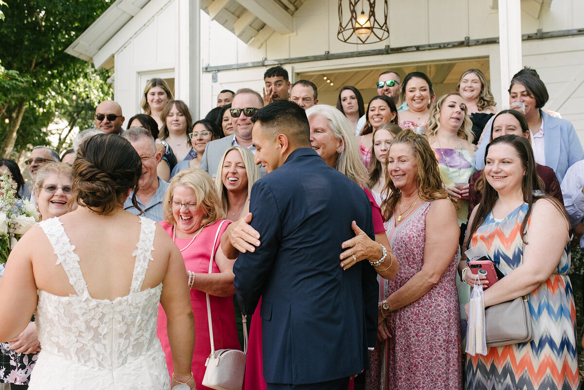 Candid wedding portrait of a couple in downtown Denver, taken by a documentary wedding photographer.