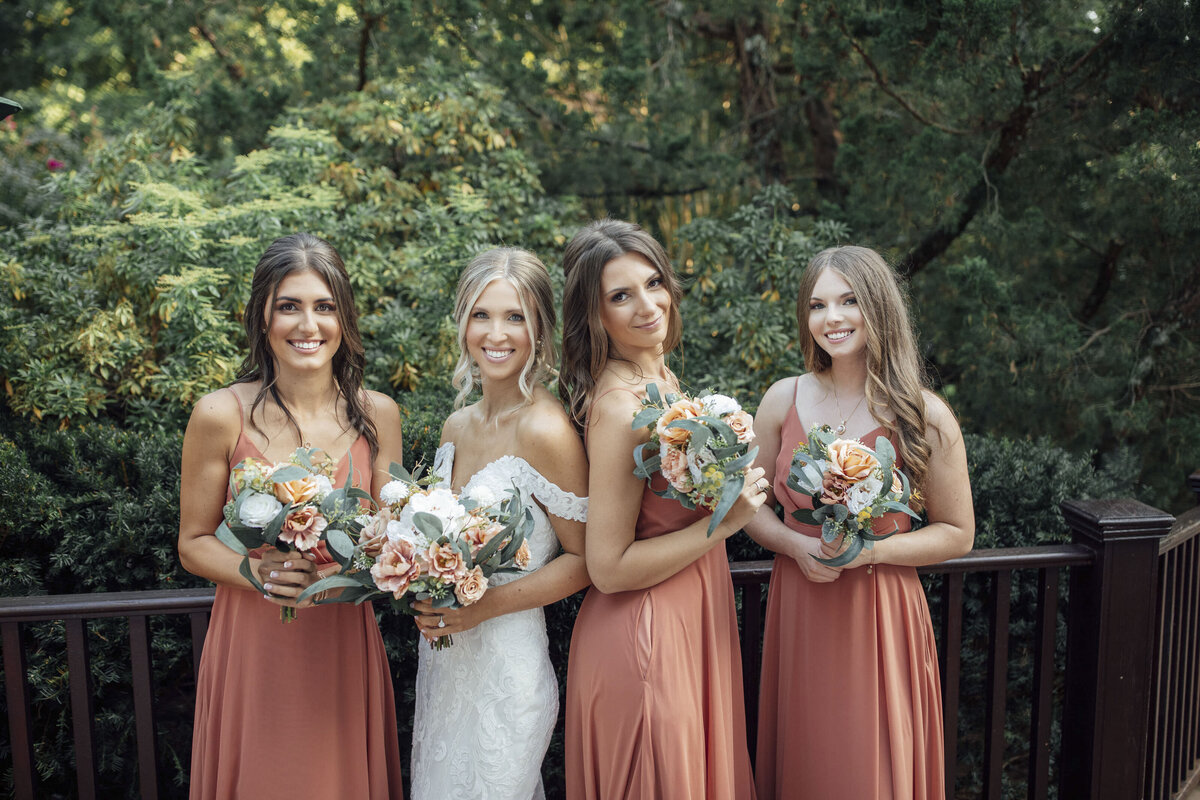 English Manor | Bride and bridesmaids smiling during summer wedding | Ocean Township, New Jersey