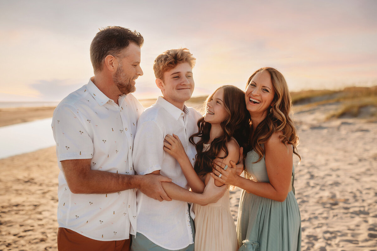 Family laughs together during Beach Pictures in Isle of Palms.