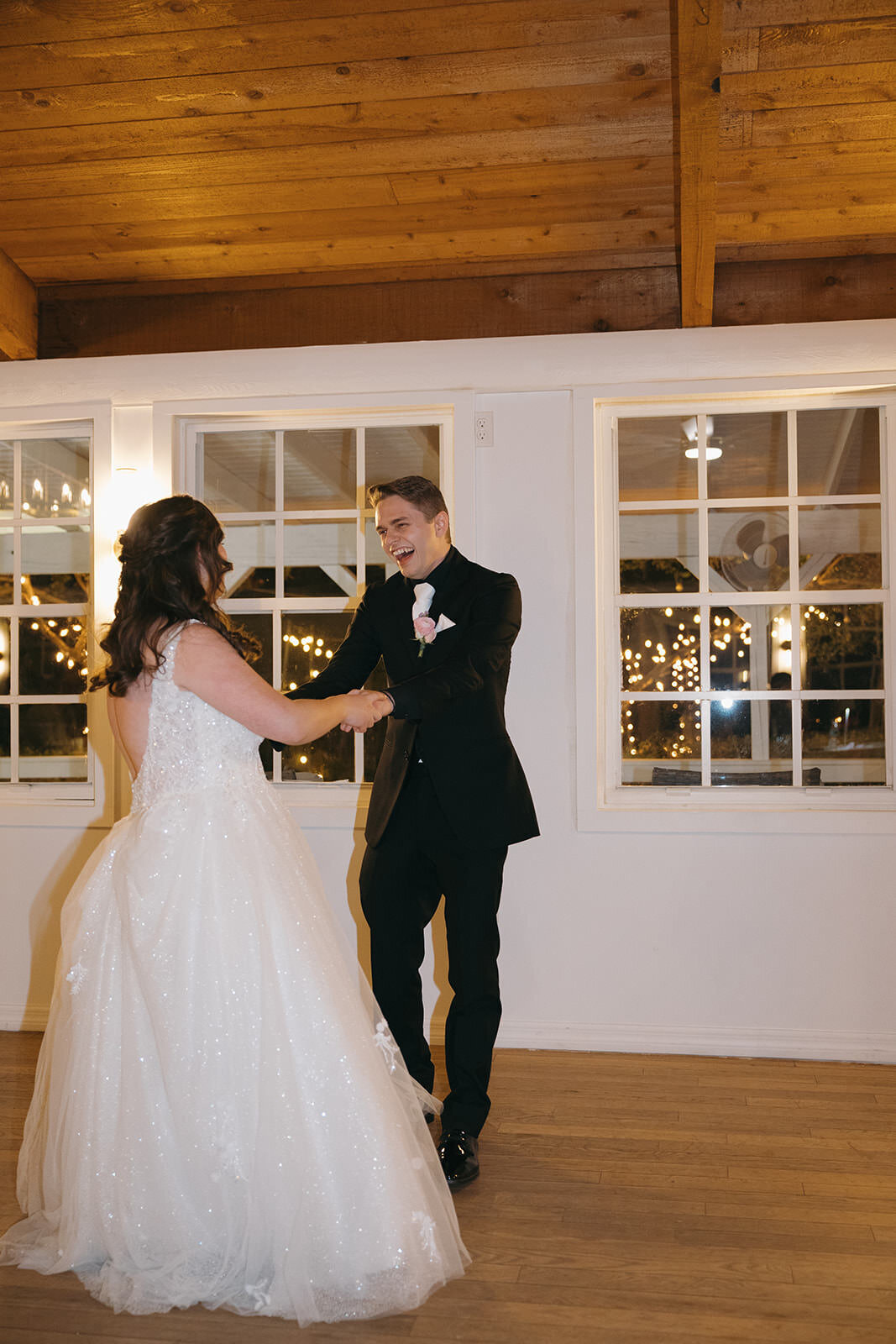 Bride and groom share their first dance inside the reception space at Uliana Estate in Lakeland Florida.