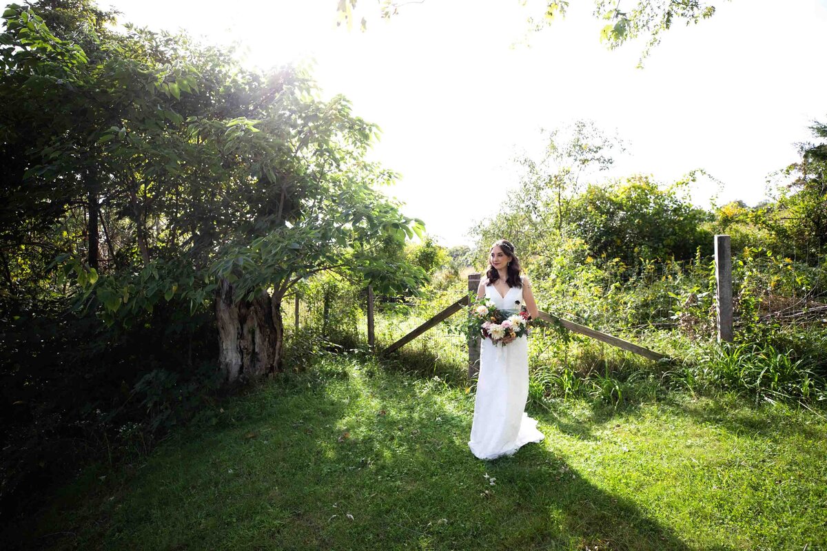 Bridal Portrait of bride standing in front of a fence at Zigbone Farm Retreat, Maryland