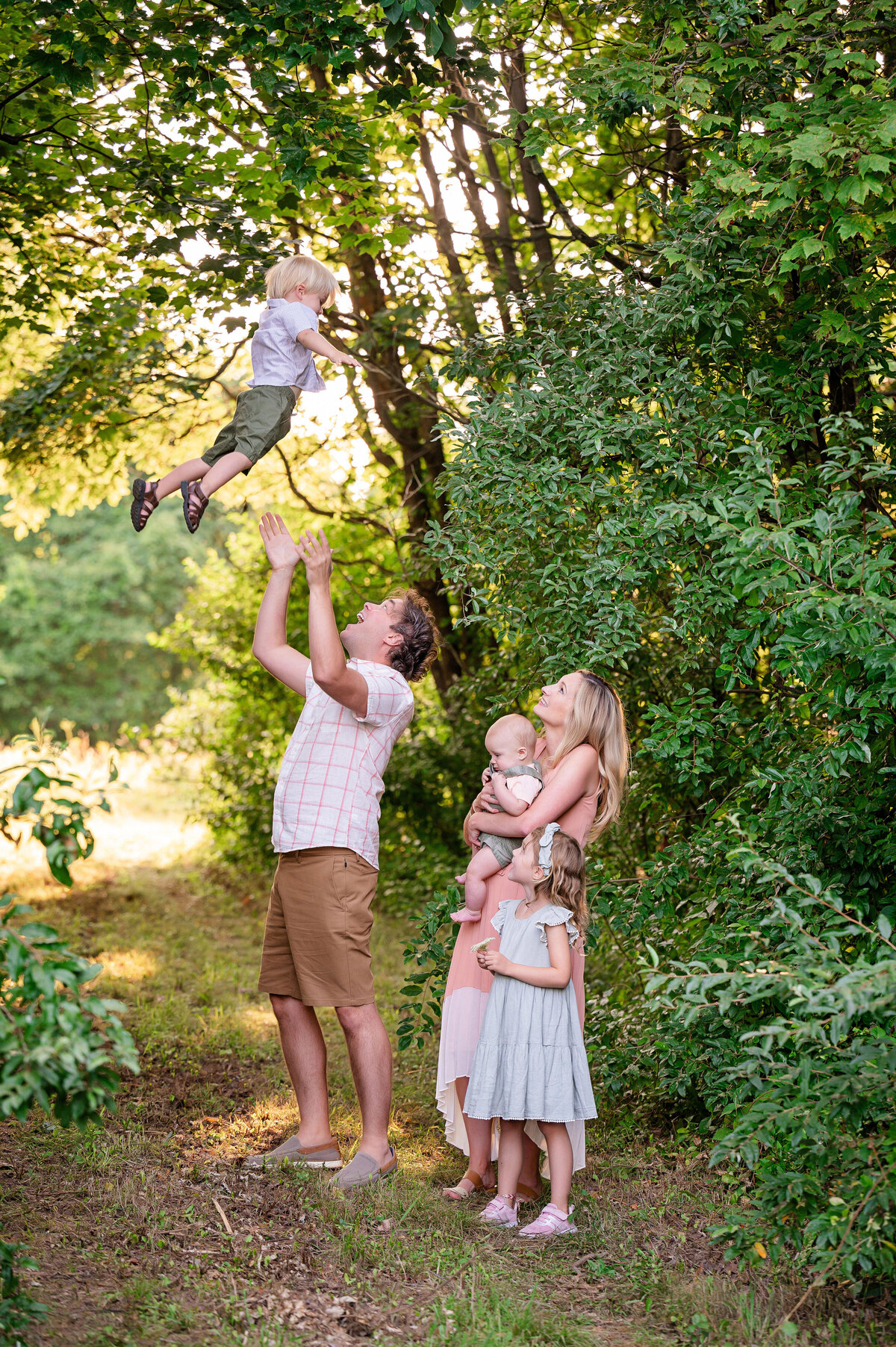 family playing outside for fun photography session