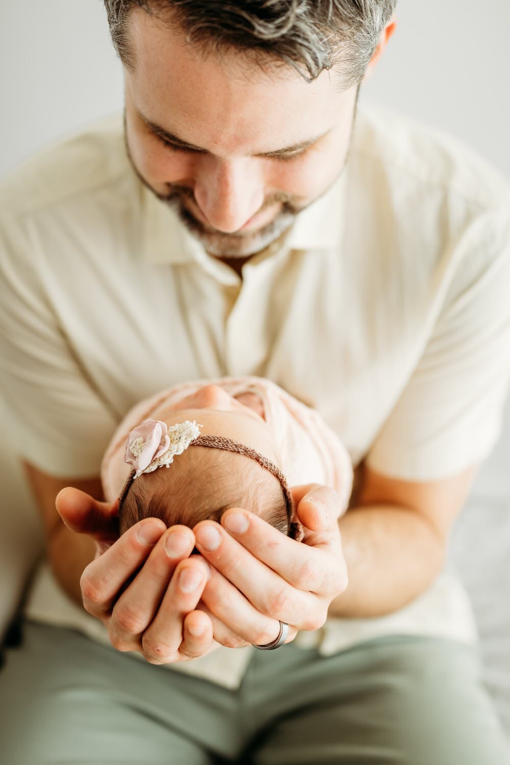 baby-in-dads-arms-studio
