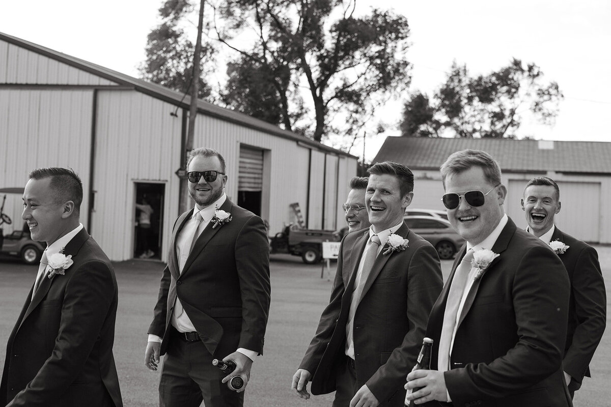 groomsmen laughing and walking