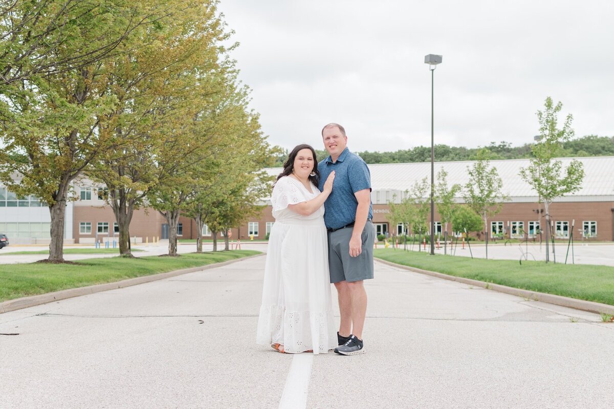 an expecting couple posing for a maternity photo