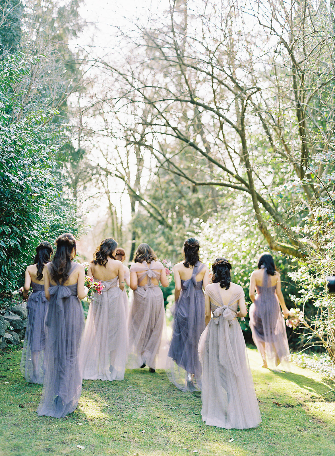 bridesmaids wearing purple jenny yoo walking