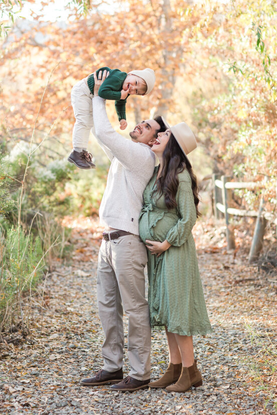 father-holding-up-son-mission-trails-san-diego-portrait