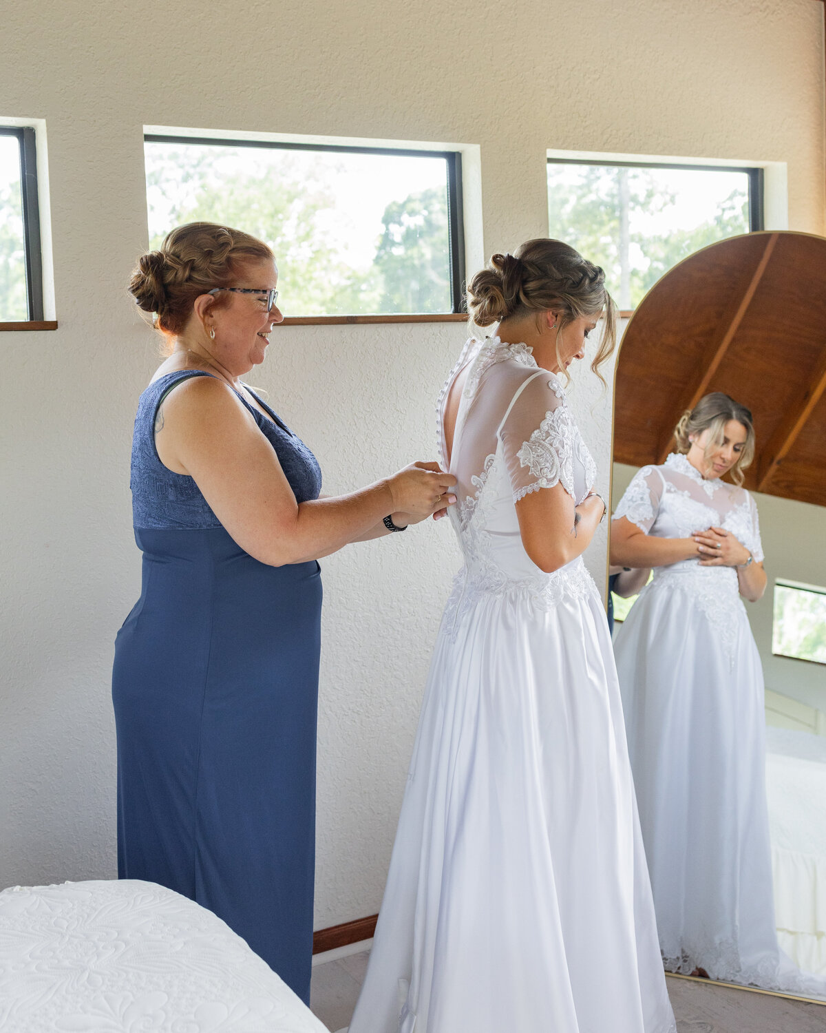 bride and mom getting ready together at Cypress Creek Farmhouse by Orlando wedding photographer Amanda Richardson Photography
