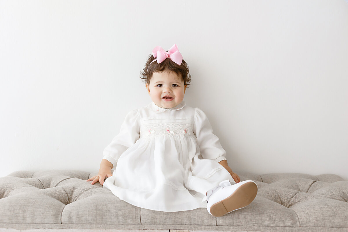 smiling toddler girl sitting